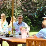 Family sitting round picnic table