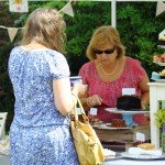 Two women at a cake stall
