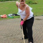 Woman scrubbing a patio