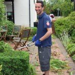 Man pruning a small hedge