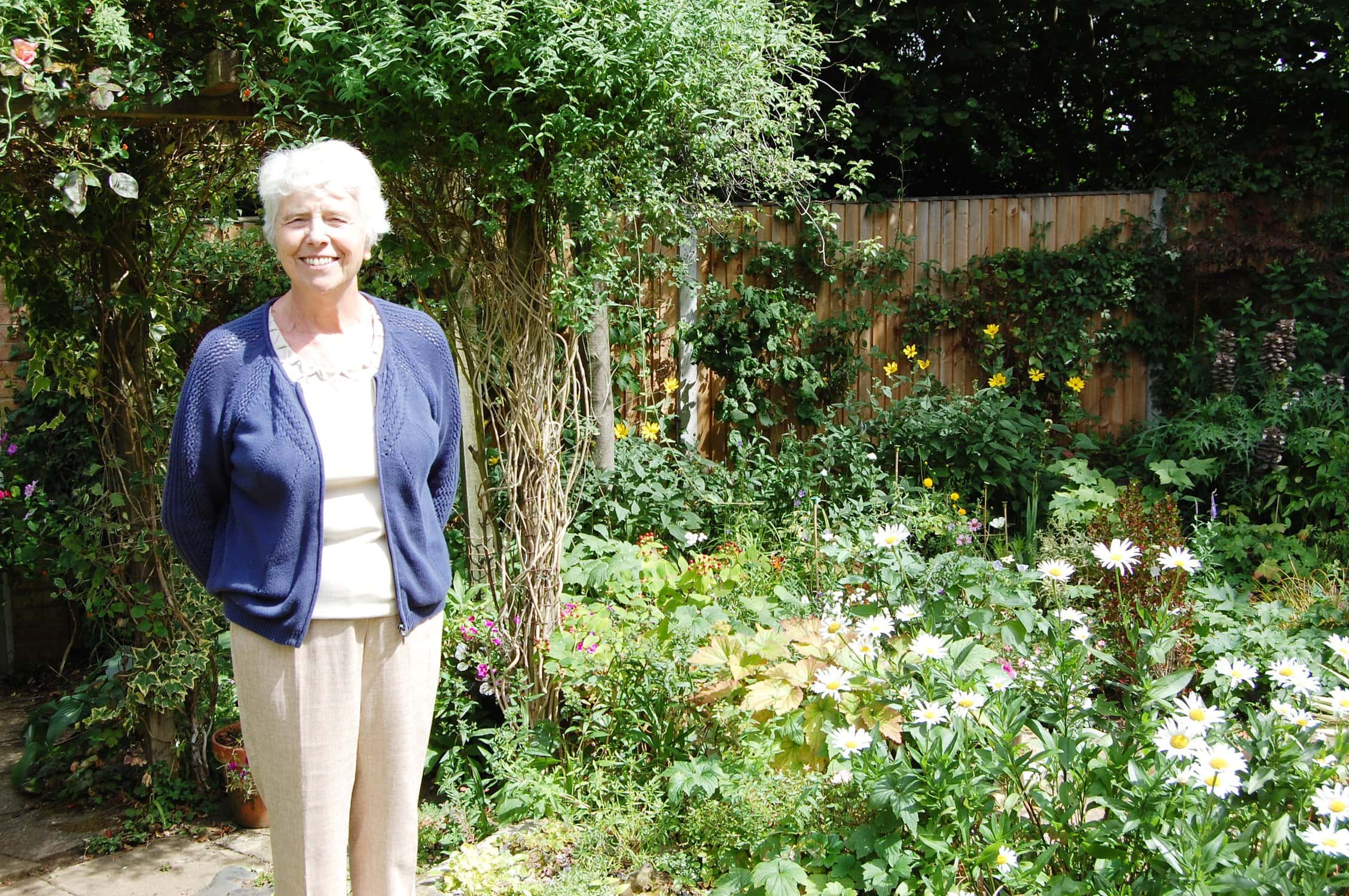 Woman standing in her garden