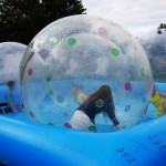 Inflatable orbs floating on water