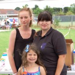 Three girls smiling to camera
