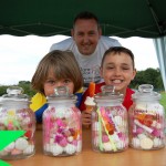 Two boys with jars filled with sweets