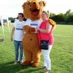 Couple cuddling bear mascot