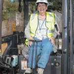 Woman at controls of digger
