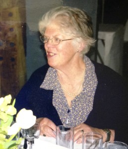 Smiling woman sat at table