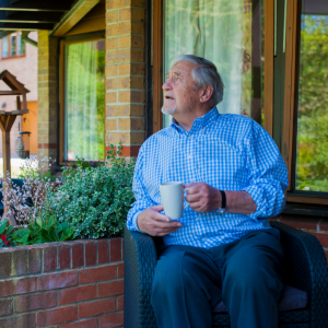 Brian sitting on the patio on the Inpatient Unit