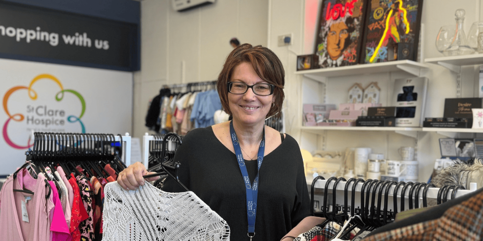Photo of St Clare Hospice Thorley shop manager. She is smiling at the camera.