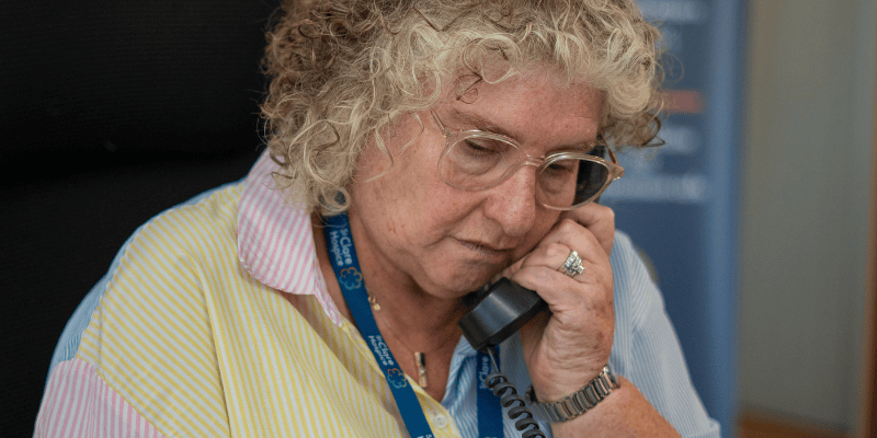 Photo of Belinda pictured on the phone.