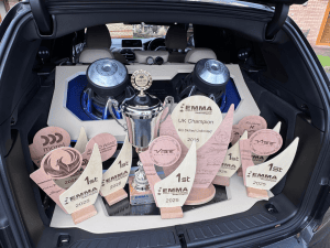 Tony's awards are pictured in the back of his car.