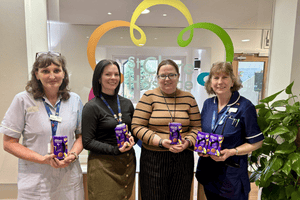 Members of the St Clare Hospice team pictured with Easter eggs.